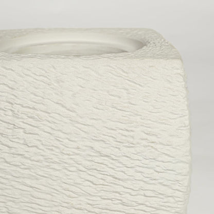 Close view of white polyresin square vase featuring rough textured surface and modern handcrafted detailing.