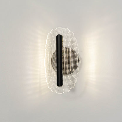 Contemporary wall light in black and gold metal finish with textured glass diffuser for bedroom or living decor lighting white background.