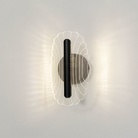 Contemporary wall light in black and gold metal finish with textured glass diffuser for bedroom or living decor lighting white background.