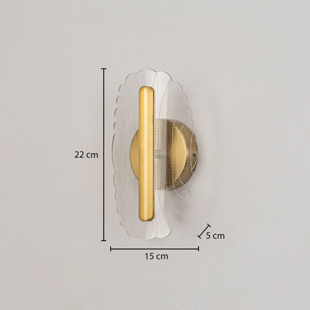 Gold metal wall light with clear acrylic decorative shade shown with 22 cm height and 15 cm width for clear sizing.