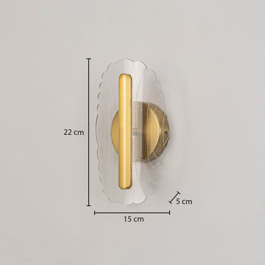 Gold metal wall light with clear acrylic decorative shade shown with 22 cm height and 15 cm width for clear sizing.