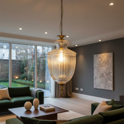 Antique brass and textured glass lantern pendant light creating sophisticated ambience in modern spaces.
