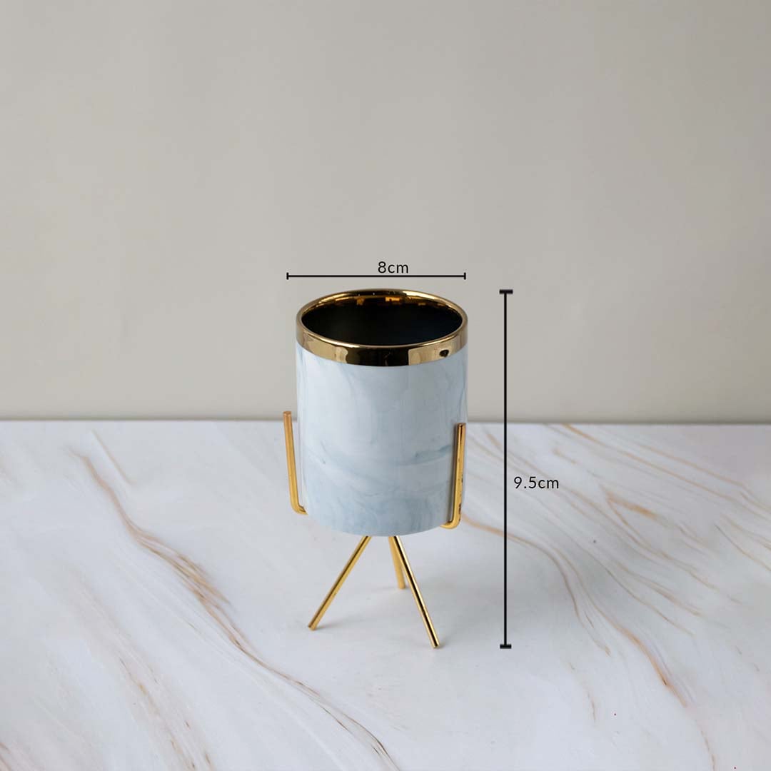 A marble finish planter on a gold stand displayed with clear size markings showing 8 cm width and 9.5 cm height for an accurate view.