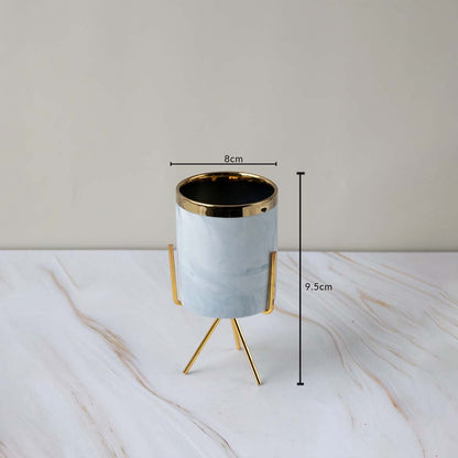 A marble finish planter on a gold stand displayed with clear size markings showing 8 cm width and 9.5 cm height for an accurate view.
