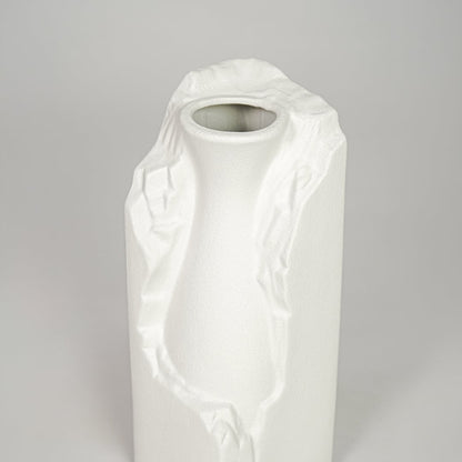 White ceramic flower vase closeup with textured finish modern decorative vase for shelf console table decor styling.