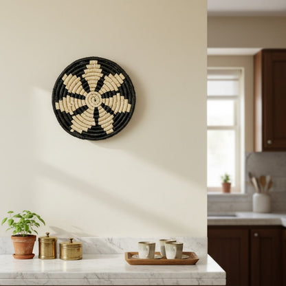 Black and beige woven wall basket placed above kitchen counter adding handcrafted texture and cozy charm to modern home Decor.