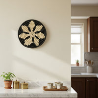 Black and beige woven wall basket placed above kitchen counter adding handcrafted texture and cozy charm to modern home Decor.