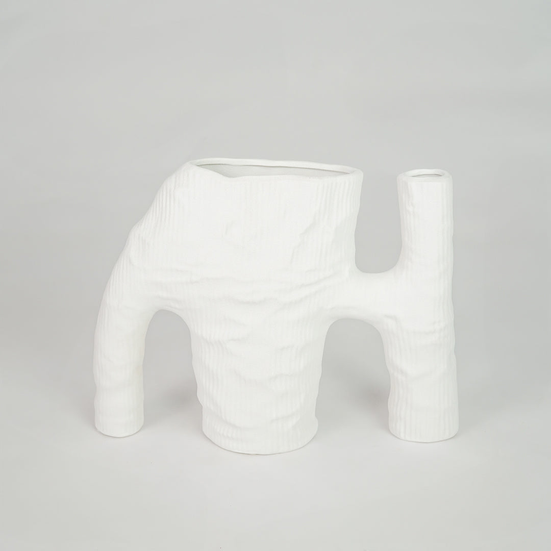 White textured ceramic vase for modern console table placement and artistic indoor home decor styling statement piece.