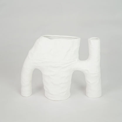 White textured ceramic vase for modern console table placement and artistic indoor home decor styling statement piece.