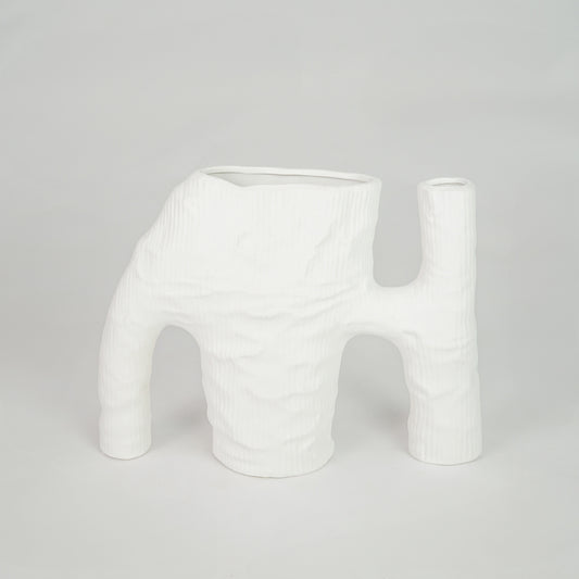 White textured ceramic vase for modern console table placement and artistic indoor home decor styling statement piece.