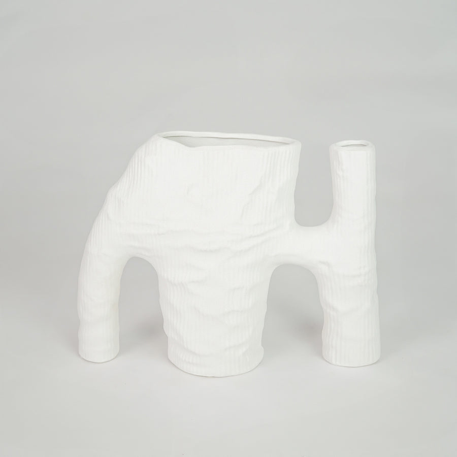 White textured ceramic vase for modern console table placement and artistic indoor home decor styling statement piece.