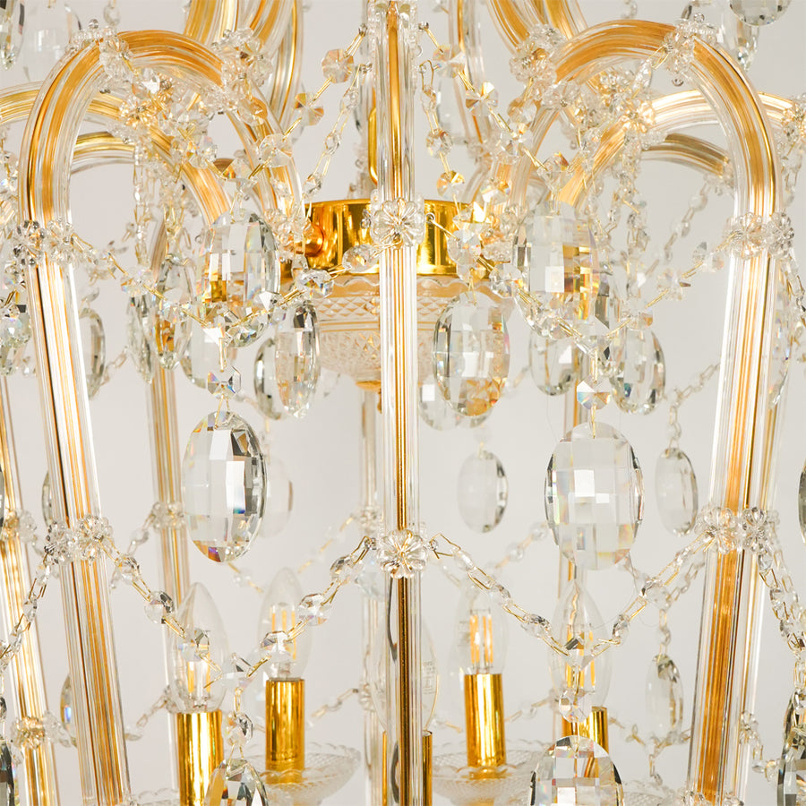 Closeup image of elegant clear crystal chandelier for luxury living room decor styling with elegant polished metal finish.