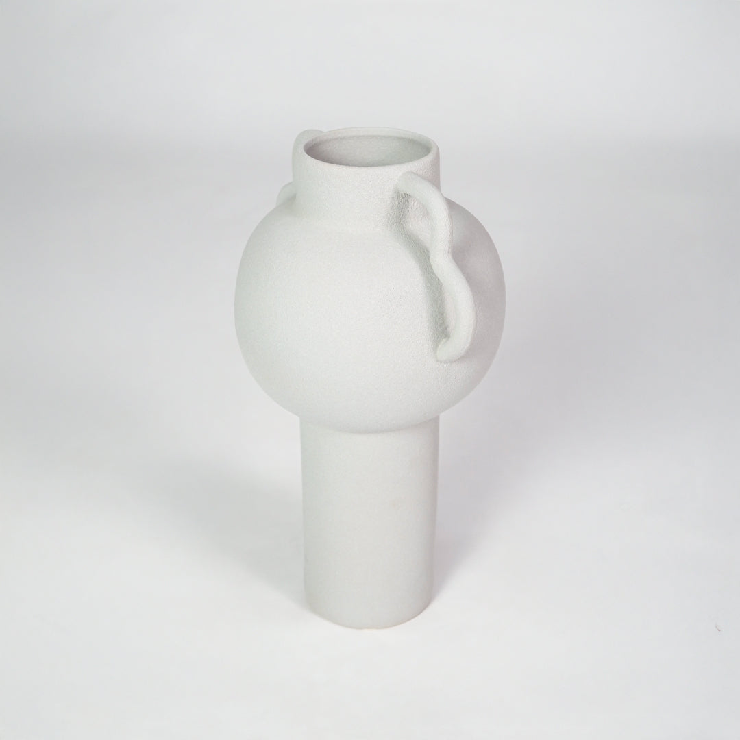 White matte ceramic vase for stylish console table placement and contemporary living room decor styling piece.