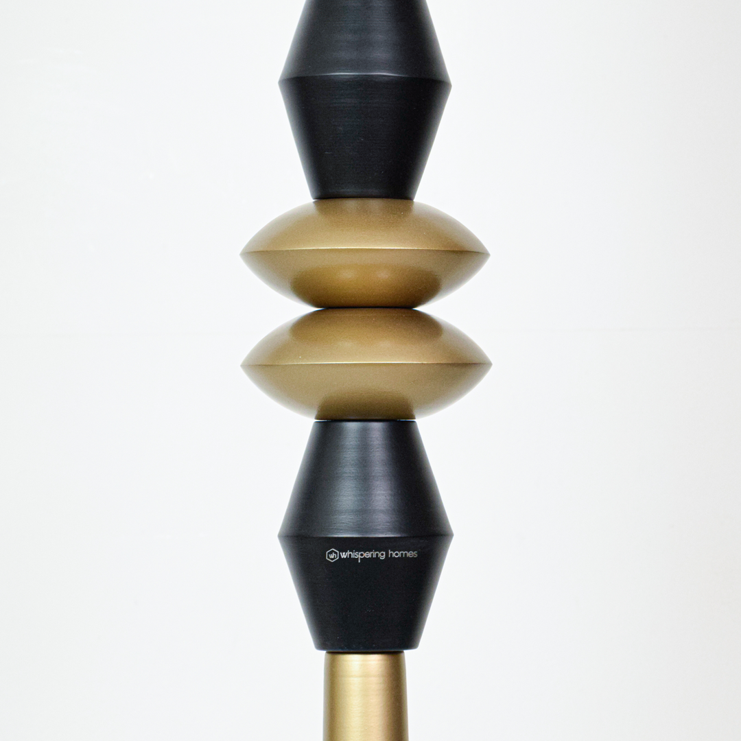 Closeup of black and gold metal pendant light highlighting artistic details and premium craftsmanship.