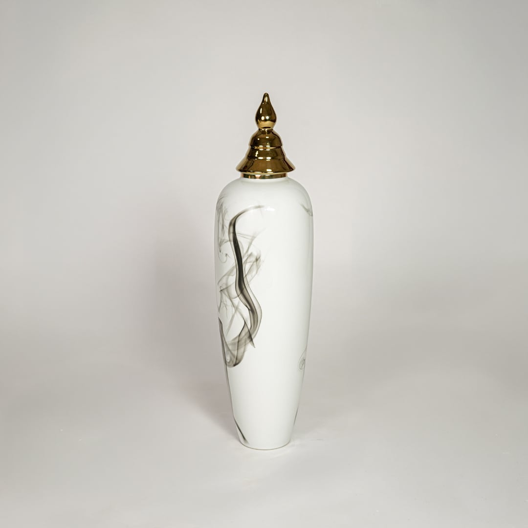 White ceramic tall decorative vase with artistic black swirl design and gold lid ideal for living room corner decor.