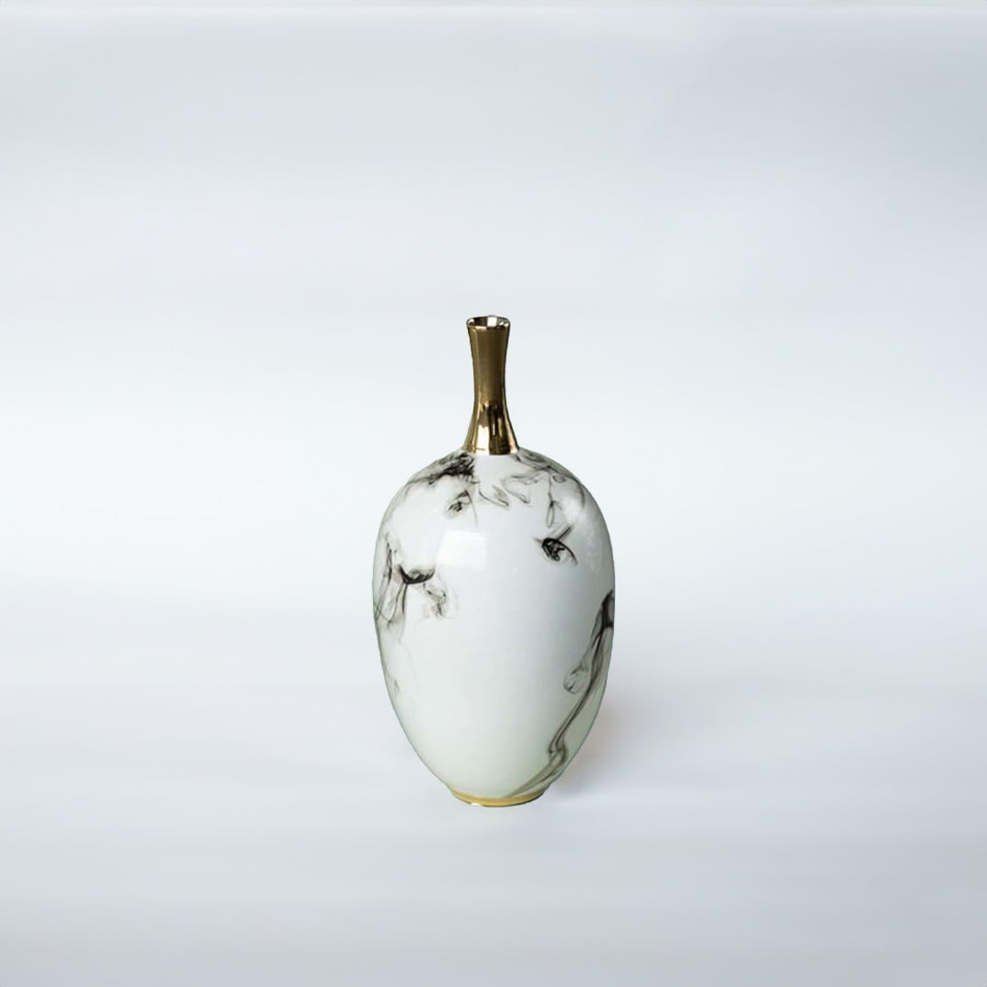 White ceramic decorative vase with grey marble pattern and gold neck for elegant shelf styling and modern home decor.