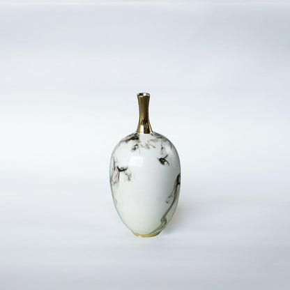 White ceramic decorative vase with grey marble pattern and gold neck for elegant shelf styling and modern home decor.
