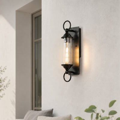 Black metal outdoor wall light with frosted glass for porch entrance balcony and exterior walls with warm lighting.