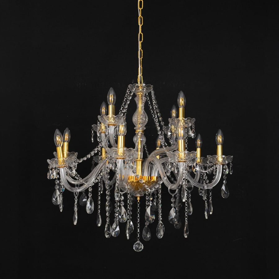Chandelier with crystal glass and gold finish displayed off against black background for classic home style.