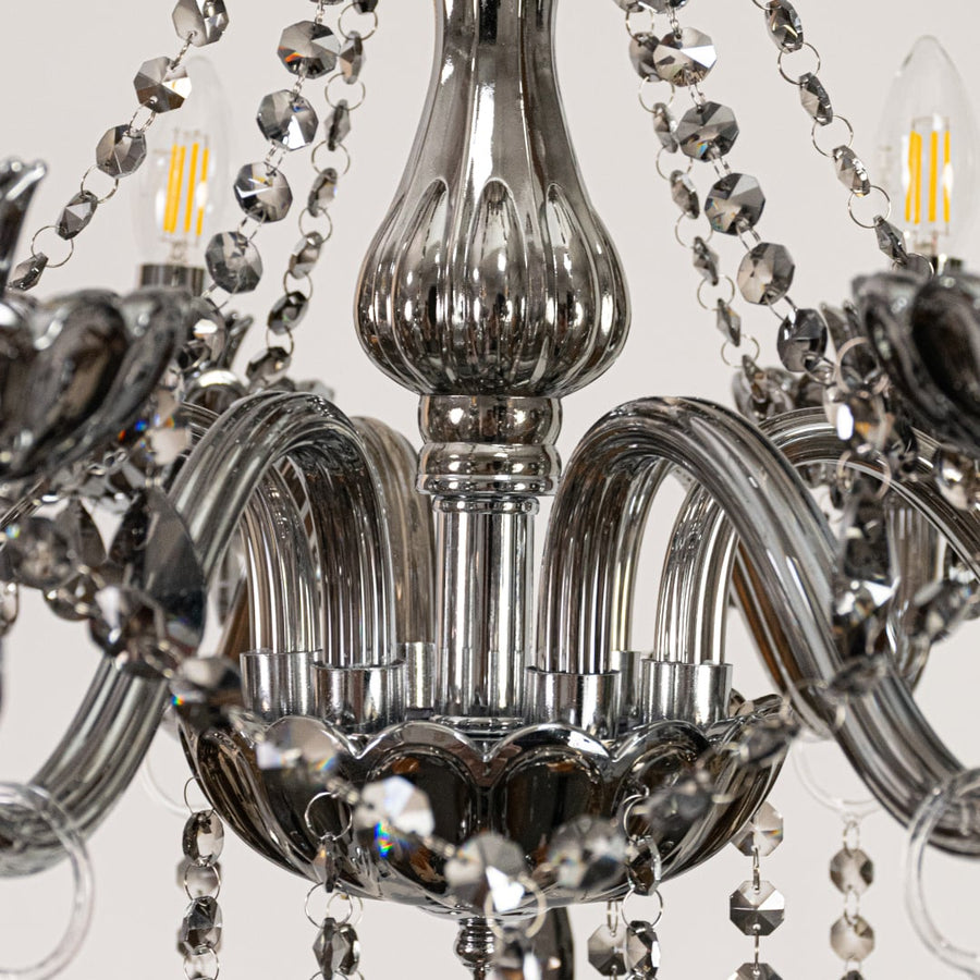 Closeup of black crystal chandelier with detailed beads and curved arms perfect for premium home ceiling lighting.