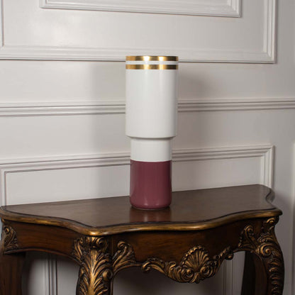 Modern white and maroon ceramic vase with gold detailing shown on a clean white background ideal for minimal elegant home styling.