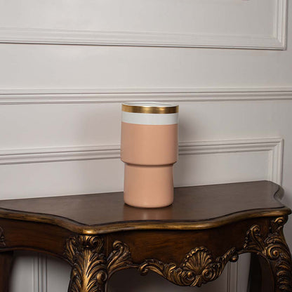 Peach ceramic vase with gold rim and white band displayed on a clean white background ideal for minimal modern home styling.