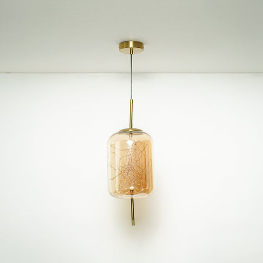 Amber textured glass pendant light with brass accents suspended in modern interiors adding warm elegance and ambient lighting.