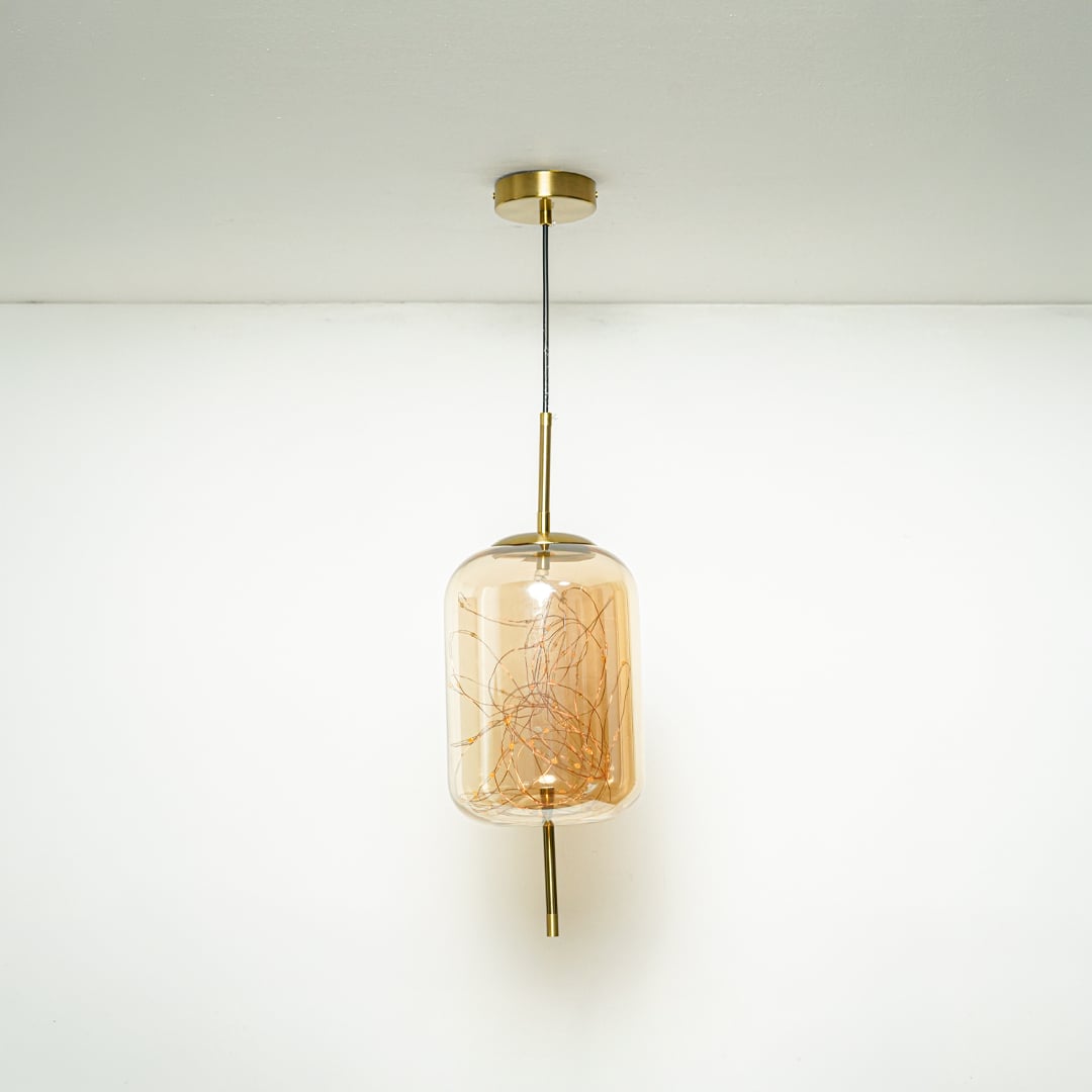 amber glass hanging lamp - cylinder light off white background