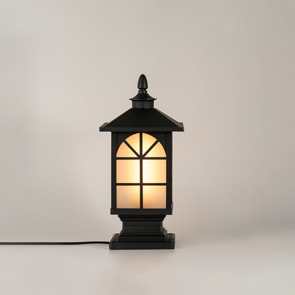 Black outdoor gate light with warm glowing glass panels for elegant exterior decor styling use.