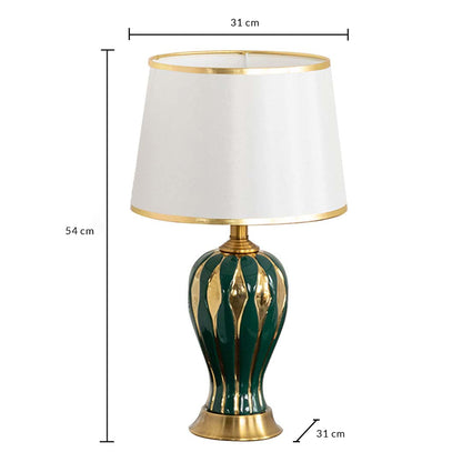 Table lamp with green and gold ceramic base and white shade shown with 31 cm width and 54 cm height for accurate decor placement.