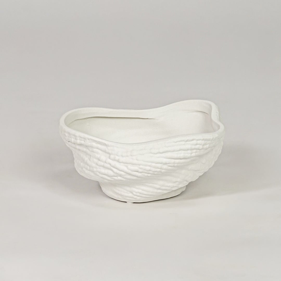 Modern white ceramic decor bowl with textured surface isolated on clean background stylish decorative bowl for center table and shelf decor.