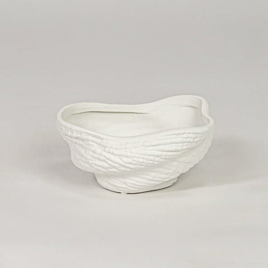 Modern white ceramic decor bowl with textured surface isolated on clean background stylish decorative bowl for center table and shelf decor.