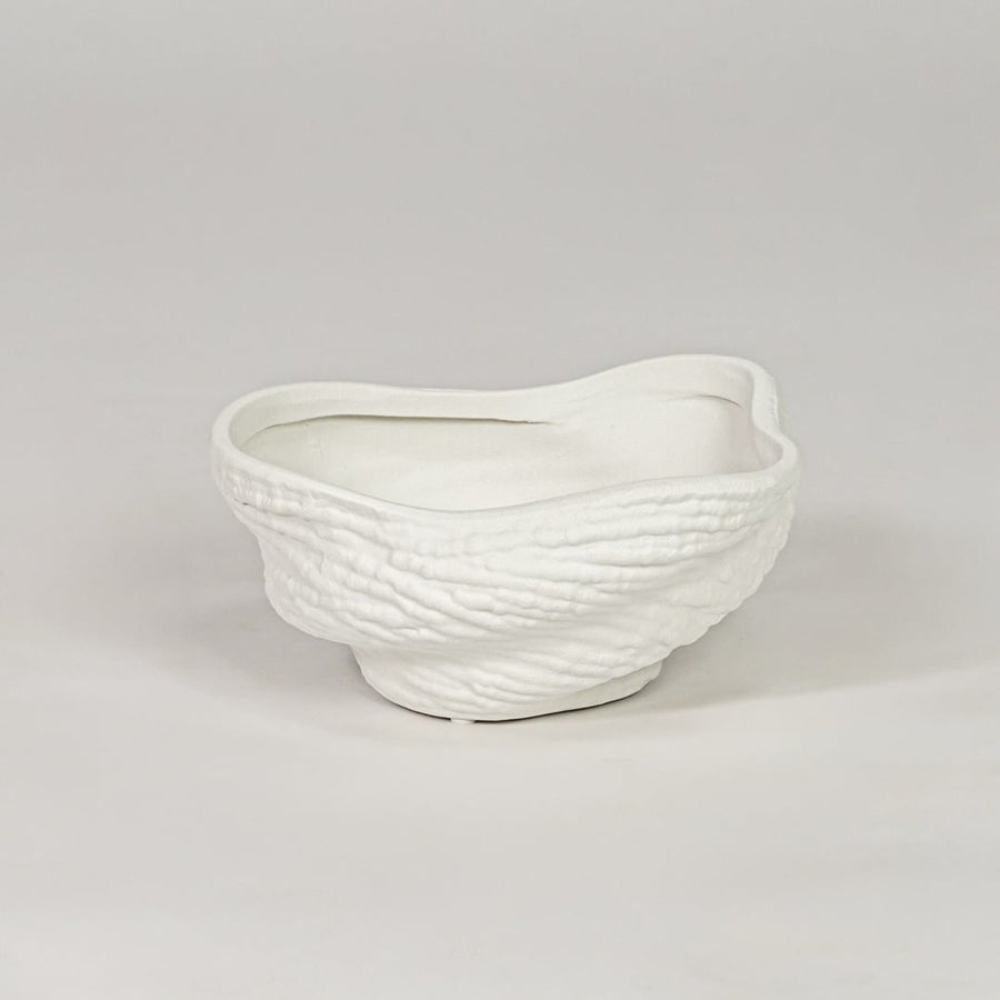 Modern white ceramic decor bowl with textured surface isolated on clean background stylish decorative bowl for center table and shelf decor.