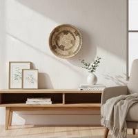 Natural woven wall basket displayed above a wooden shelf for elegant bohemian wall decor and modern interiors.