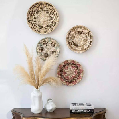 Handwoven seagrass wall basket decor set in natural tones displayed above a console table for elegant boho home style.