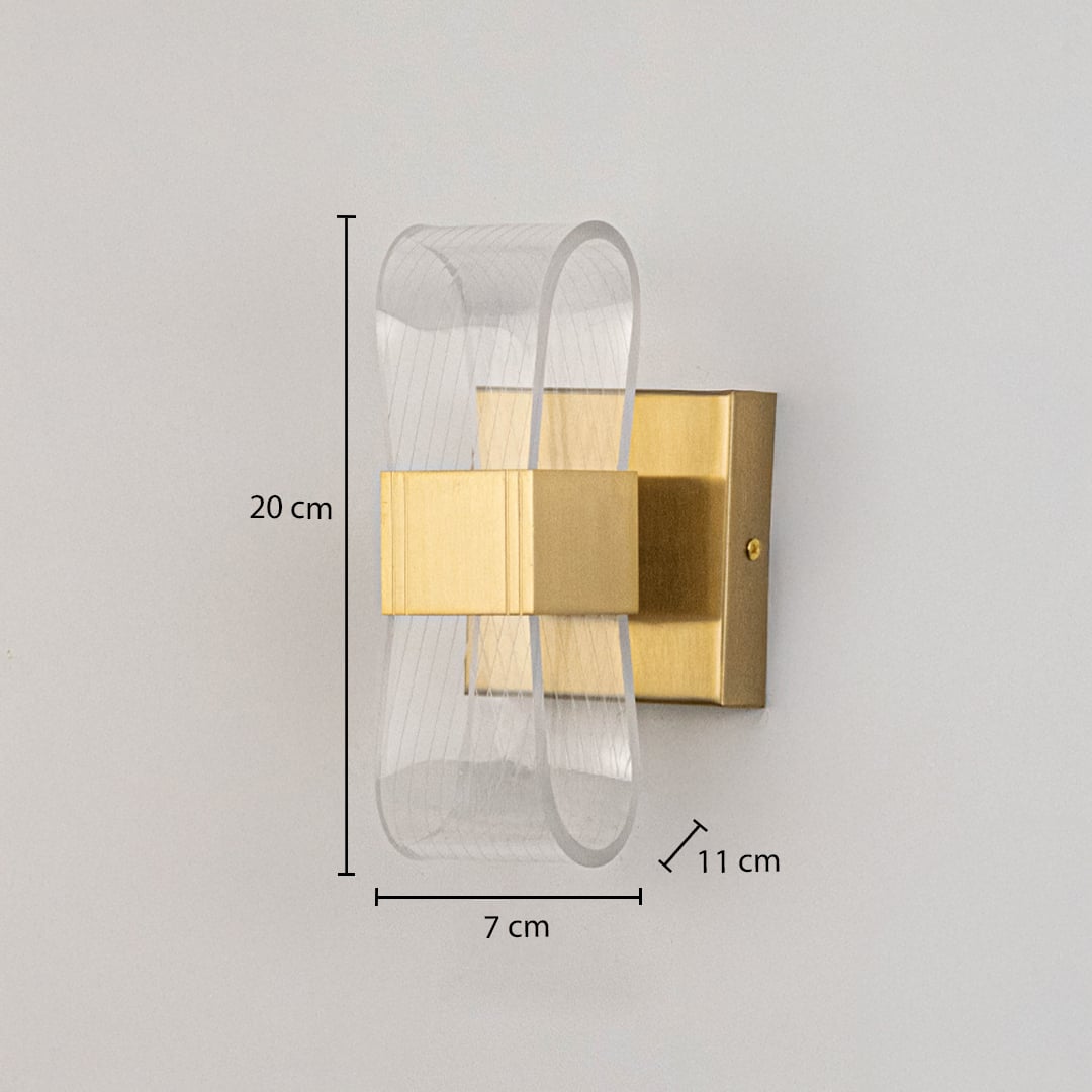 Gold metal wall light with ribbed clear glass shade shown with 20 cm height and 7 cm width for precise sizing.
