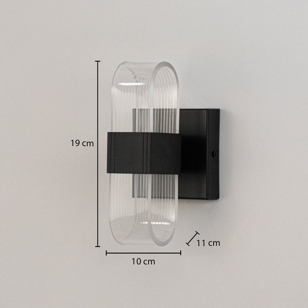 Black wall light with ribbed clear glass shade shown with 19 cm height and 10 cm width for precise sizing.