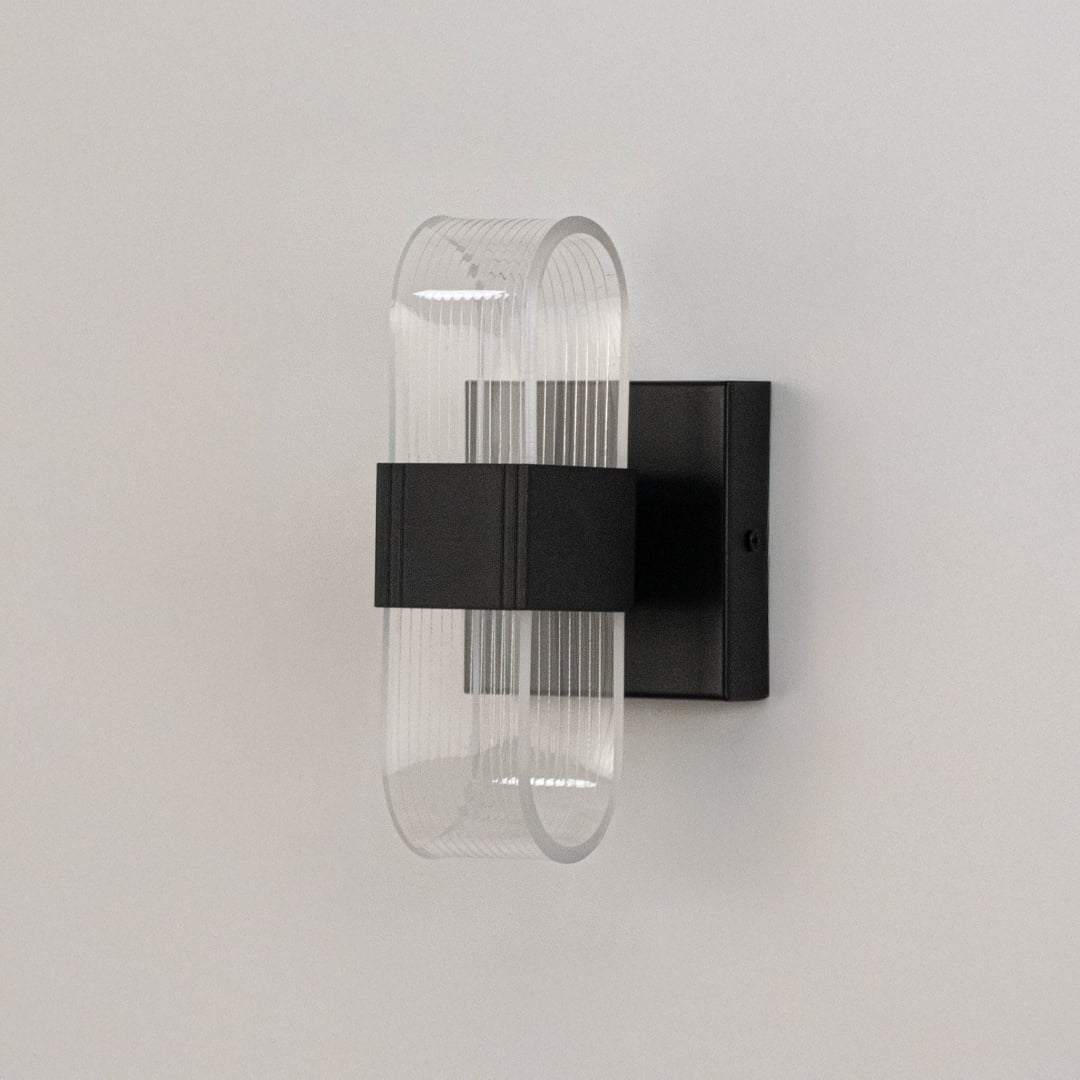 Black wall light with ribbed clear glass shade shown on a bright white background for accurate detailing.
