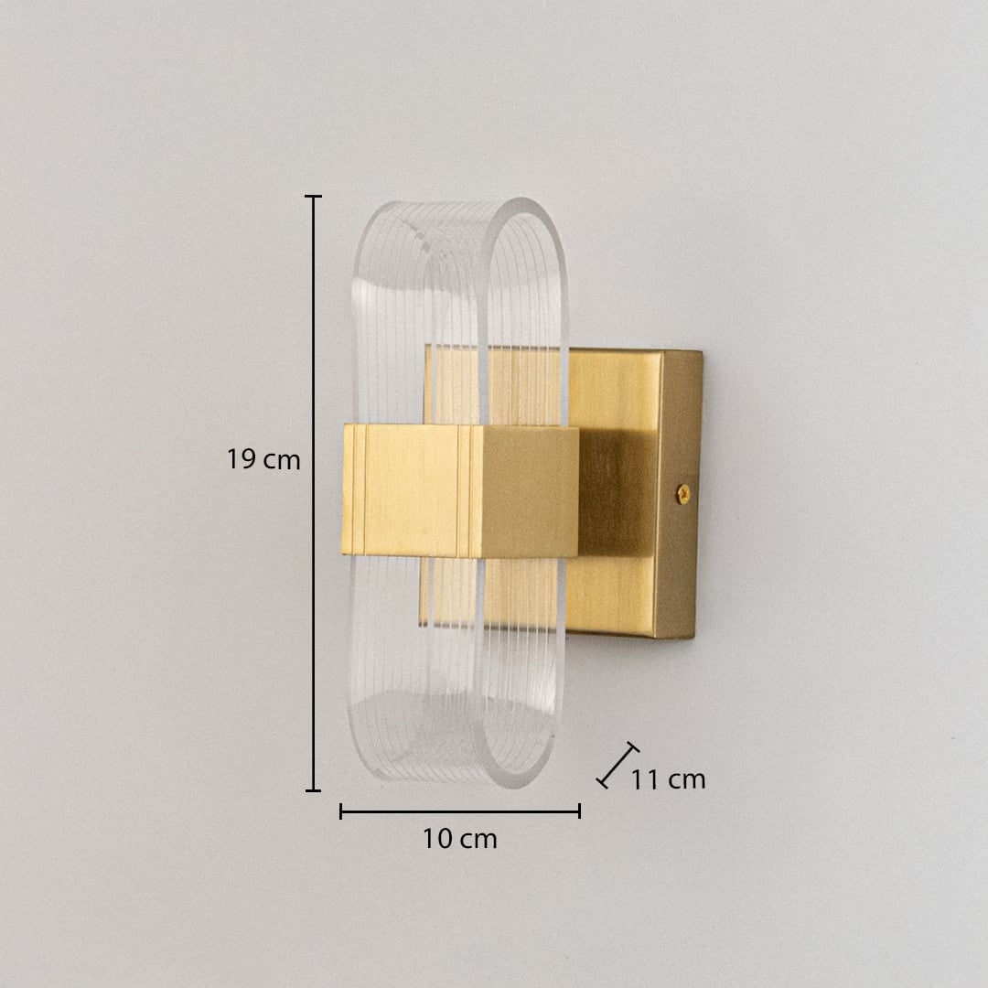Gold metal wall light with ribbed clear glass shade shown with 19 cm height and 10 cm width for precise sizing.