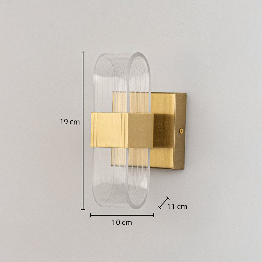 Gold metal wall light with ribbed clear glass shade shown with 19 cm height and 10 cm width for precise sizing.