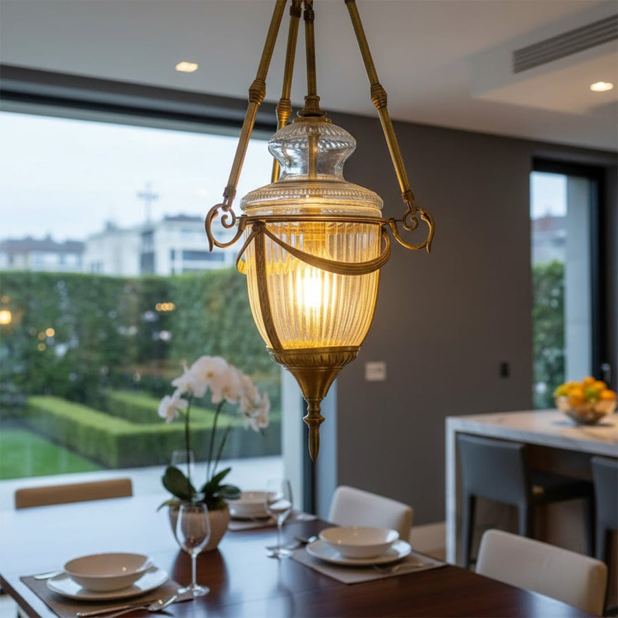 Antique brass and ribbed glass lantern pendant light adding luxurious warmth to elegant interiors.