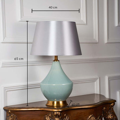 Dimensions of green table lamp showing 65 cm height and 40 cm width clearly marked to display proportion and design scale.