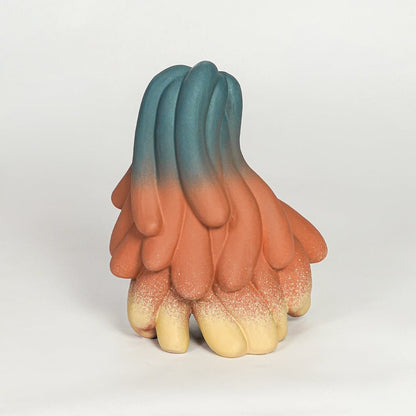 Abstract multicolor ceramic decor sculpture on white background modern artistic statement piece for contemporary interiors.