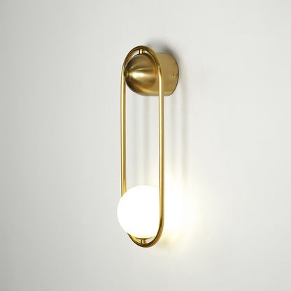 Gold metal wall light on white background with frosted globe shade for modern luxury wall decor.
