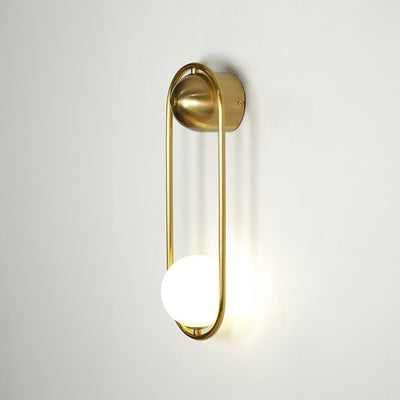 Gold metal wall light on white background with frosted globe shade for modern luxury wall decor.