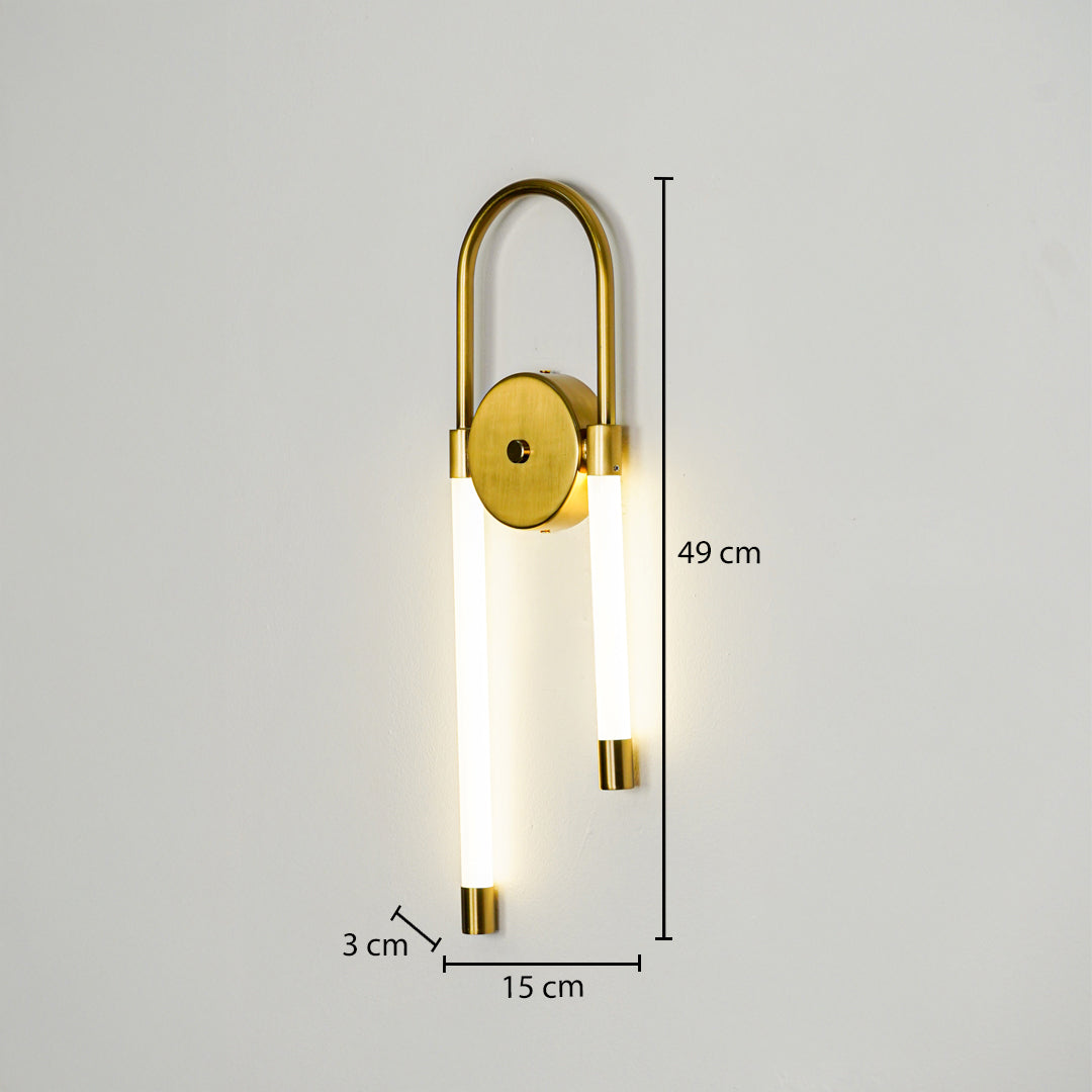 Modern gold wall light with dual vertical LED tubes mounted on neutral wall background 49 cm height 15 cm width 3 cm depth ideal for contemporary interior lighting.