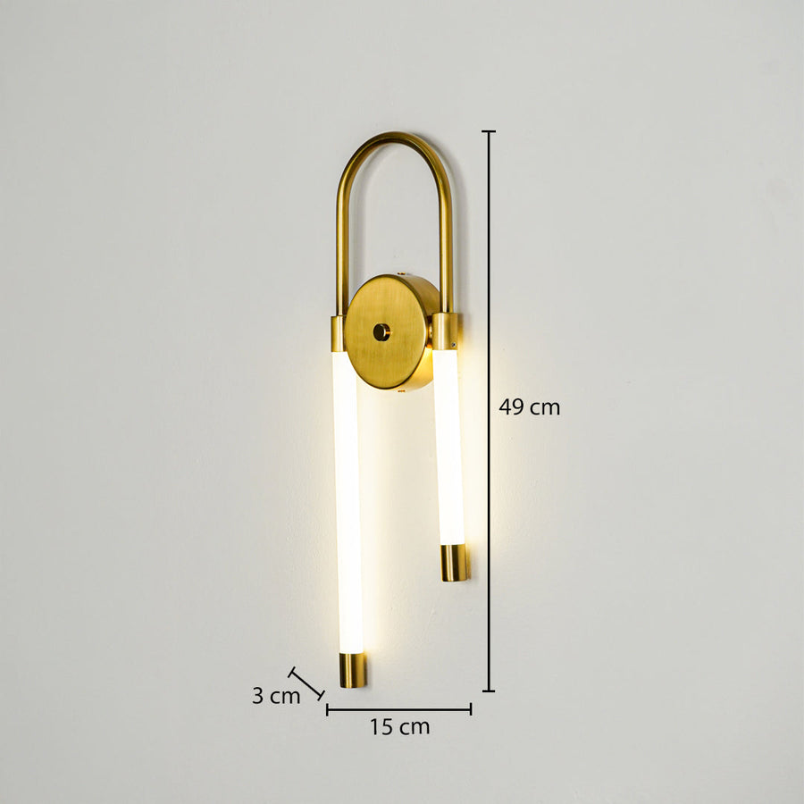 Modern gold wall light with dual vertical LED tubes mounted on neutral wall background 49 cm height 15 cm width 3 cm depth ideal for contemporary interior lighting.