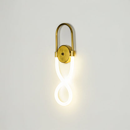 Minimal gold wall light with glowing loop LED tube on clean neutral wall background ideal for stylish bedroom or hallway decor lighting.
