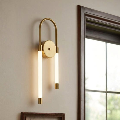 Contemporary gold wall light with dual white glass shades mounted beside window on neutral wall ideal for stylish bedroom or living room decor.