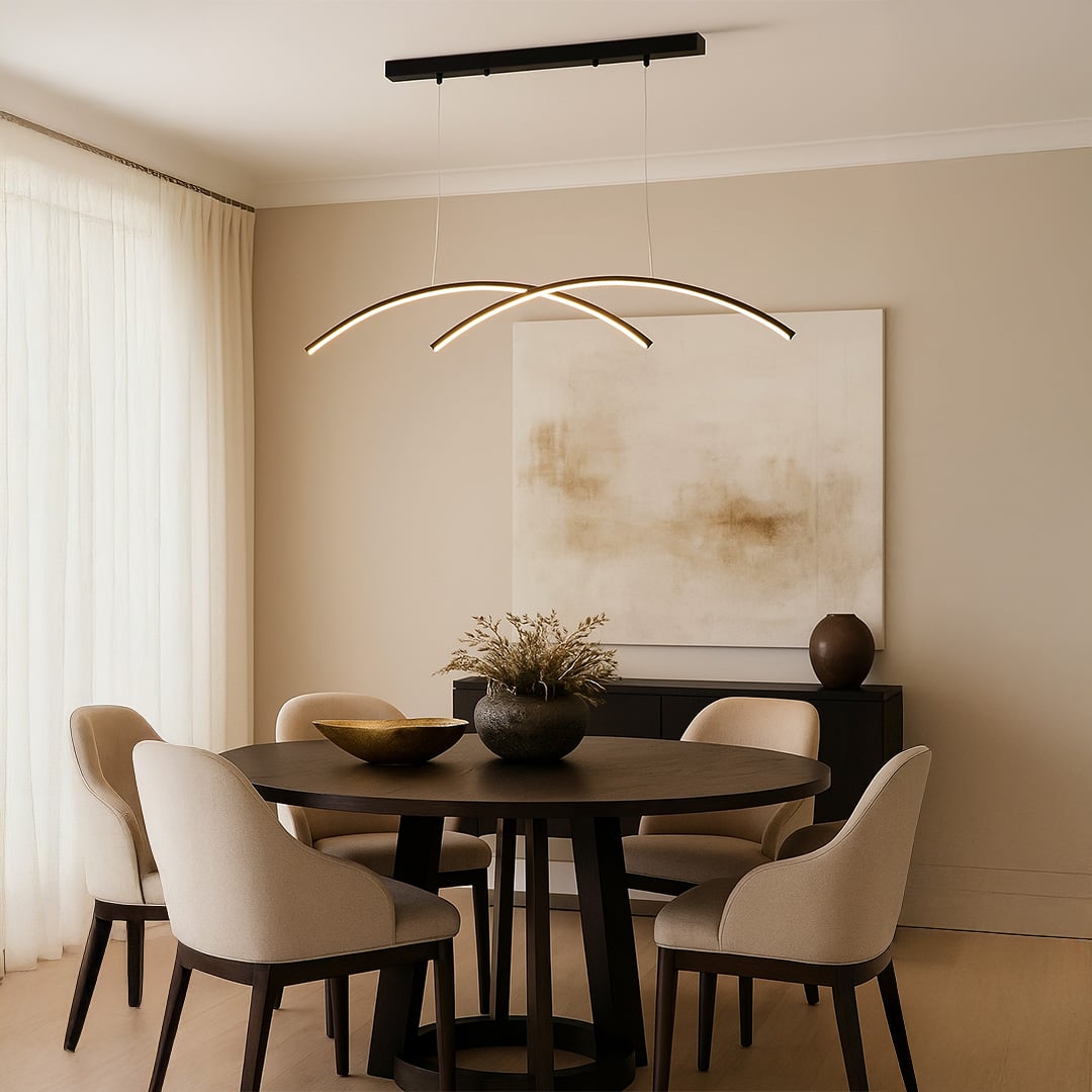 Contemporary curved LED ceiling light installed above a dining table delivering ambient glow with a clean minimalist shape ideal for modern home aesthetics.